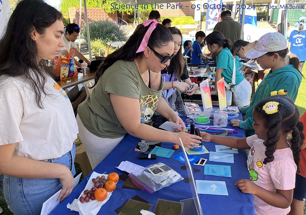 Student volunteers from Las Positas College demonstrate cyanotype imaging at Science in the Park.